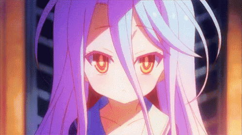 a close up of a girl with purple hair and orange eyes .