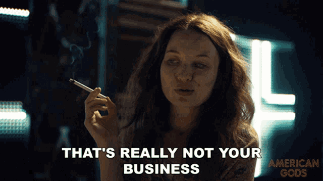 a woman smoking a cigarette with the words that 's really not your business above her