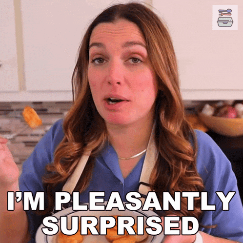 a woman in an apron is eating french fries and says i 'm pleasantly surprised