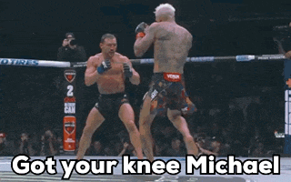 two men in a boxing ring with the words got your knee michael above them