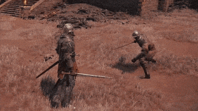 a man in armor is holding a sword in a field with fire coming from it .