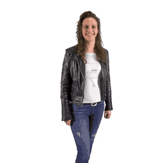 a woman wearing a black leather jacket blows a kiss