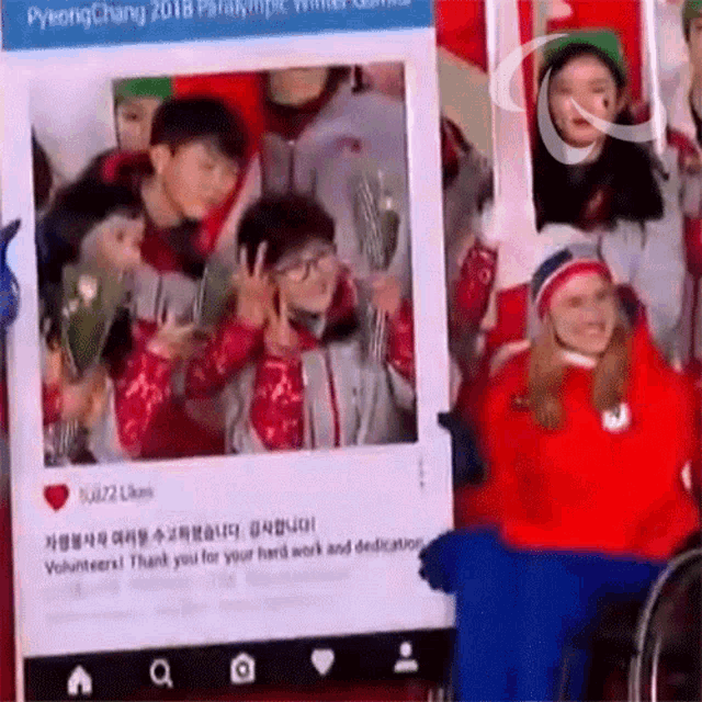 a group of people are posing for a picture in a pyeongchang 2018 paralympic photo booth