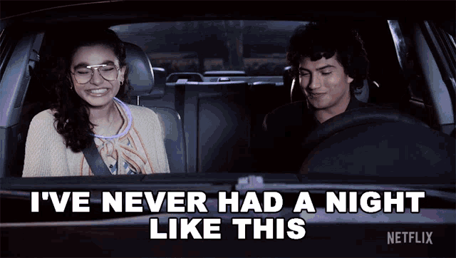 a man and a woman are sitting in a car with the words " i 've never had a night like this "