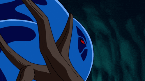 a blue object with a red eye is surrounded by branches