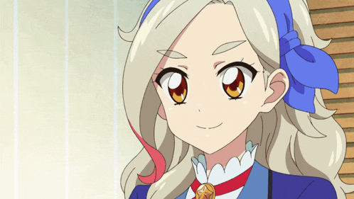a cartoon girl with blonde hair and a blue bow on her head