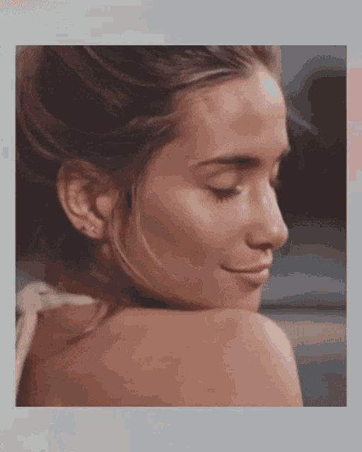 a close up of a woman with her eyes closed