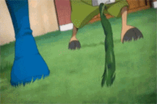 a cartoon character is standing on a lush green field with a hose hanging from his leg .