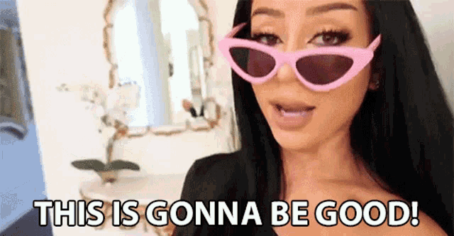 a woman wearing pink sunglasses is standing in front of a mirror and says `` this is gonna be good '' .