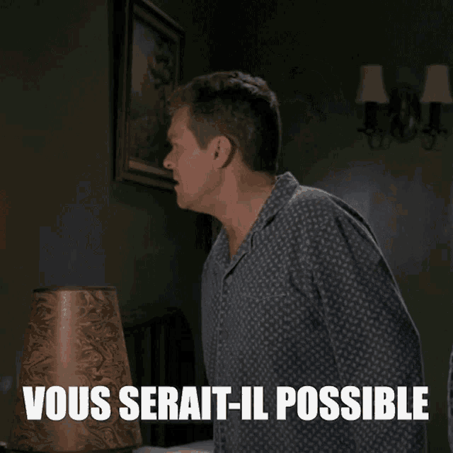a man in a striped robe is standing in front of a lamp with the words vous serait-il possible above him