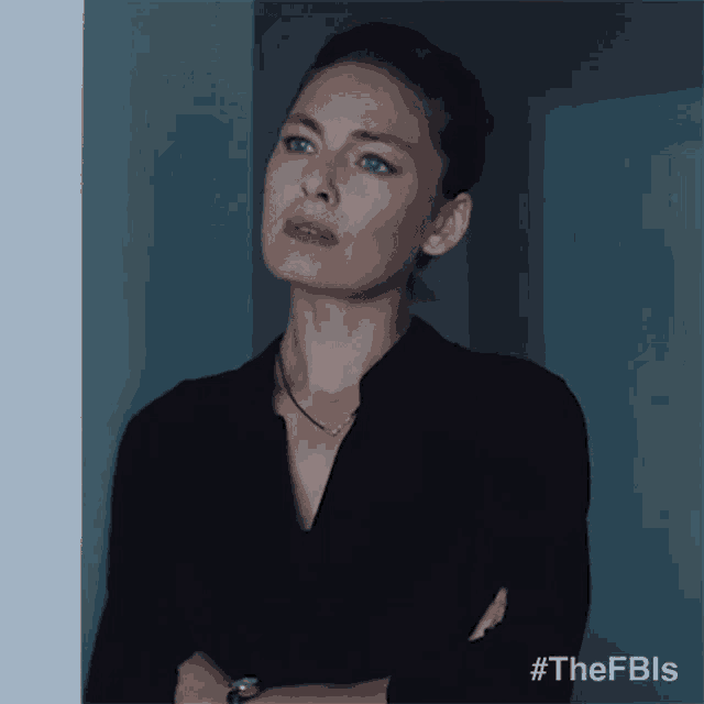 a woman leaning against a wall with the hashtag #thefbls on the bottom right
