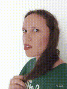 a woman in a green shirt with the word yulizie on the bottom