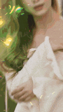 a blurry picture of a woman in a white dress with a green background