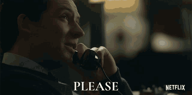 a man talking on a telephone with the word please written below him