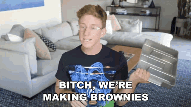 a man in a living room with the words " bitch we 're making brownies "
