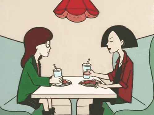 a cartoon of two girls sitting at a table with drinks and pizza .