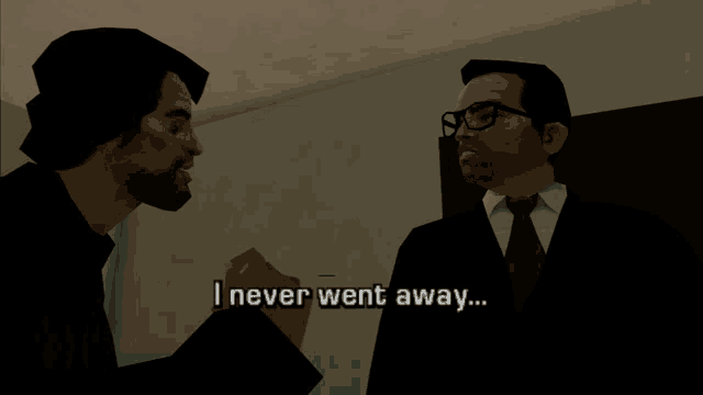 a man in a suit and tie talks to another man in a dark room with the words " i never went away " above them