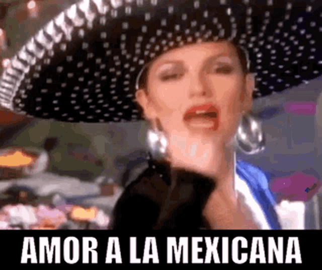 a woman wearing a sombrero with the words amor a la mexicana on the bottom