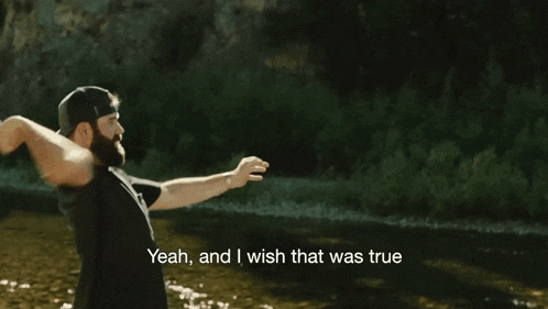 a man throws a frisbee in the air with the words yeah and i wish that was true below him