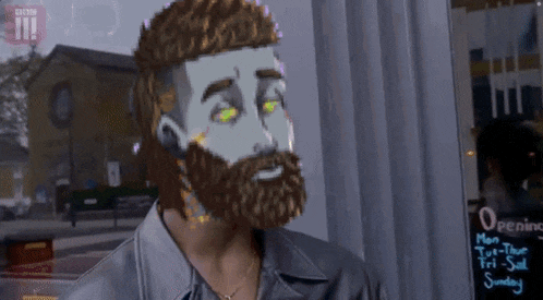 a man with a beard is standing in front of a sign that says opening