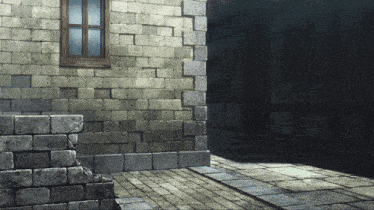 a brick wall with a window and a stone walkway