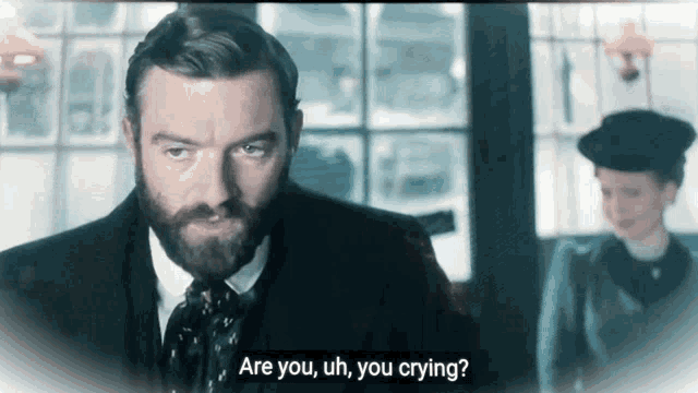a man with a beard says " are you uh, you crying "