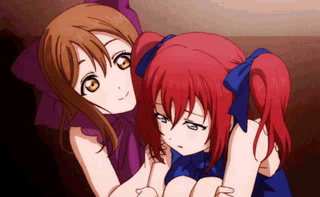 two anime girls are hugging each other and one has a blue bow in her hair