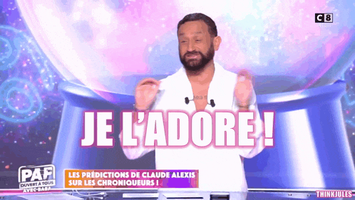 a man stands in front of a globe that says je l'adore