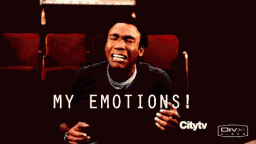 a man is sitting in a theater with the words my emotions written on the screen
