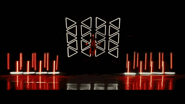 a fireworks display with triangles in the middle