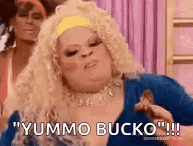a woman in a drag queen costume is holding a piece of chicken .