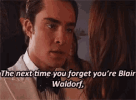 a man in a suit and bow tie is talking to a woman and the next time you forget you 're blair waldorf