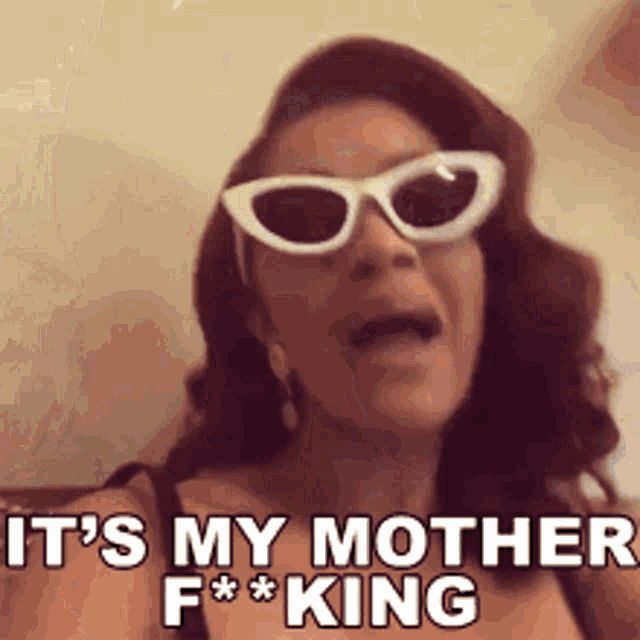 a woman wearing sunglasses is saying it 's my mother f * king