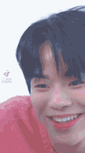 a close up of a person 's face with a smile on their face .