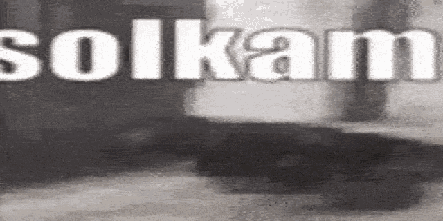 a black and white photo with the word solkam written in white letters