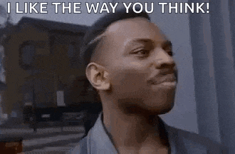 a man is standing in front of a building and says `` i like the way you think '' .