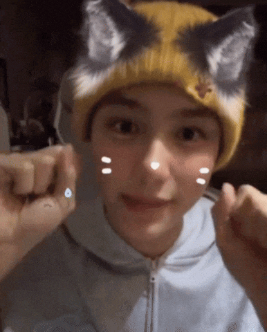 a person wearing a cat hat with ears on it