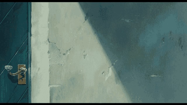 a blue door with a gold handle is against a blue wall