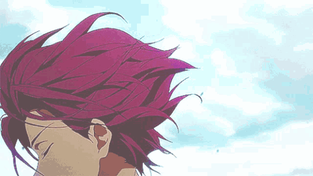 a close up of a person 's hair against a blue sky