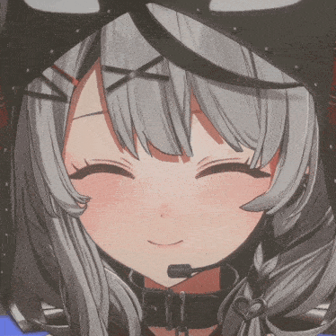 a close up of a girl 's face with a smile