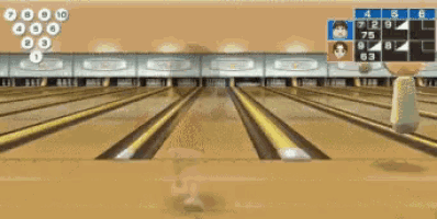 a person is playing bowling on a bowling alley with a blue ball