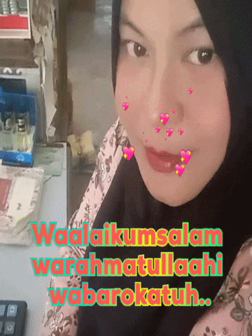 a woman wearing a hijab has hearts on her face and the words waalaikumsalam warahmatullaahi wabarokatuh