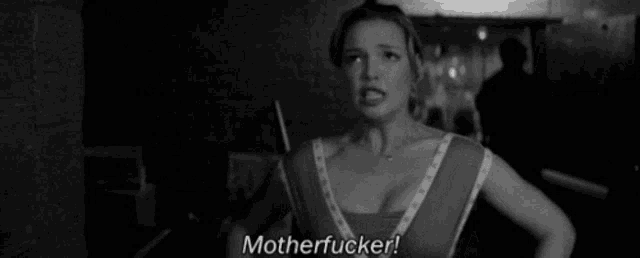 a black and white photo of a woman saying motherfucker !