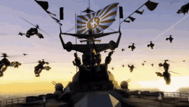 a large ship with a flag that has the letter k on it is surrounded by helicopters