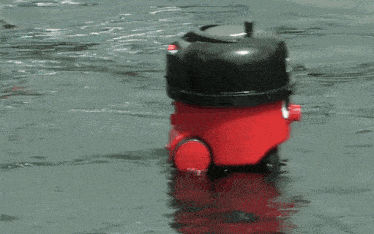 a henry vacuum is floating in the water