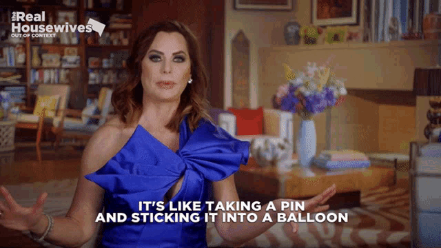 a woman in a blue dress says it 's like taking a pin and sticking it into a balloon ..
