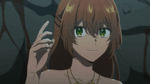 a girl with long brown hair and green eyes is looking at the camera