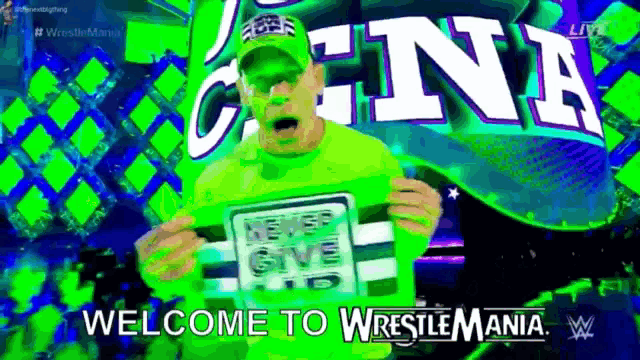 a wrestler is holding a sign that says never give up