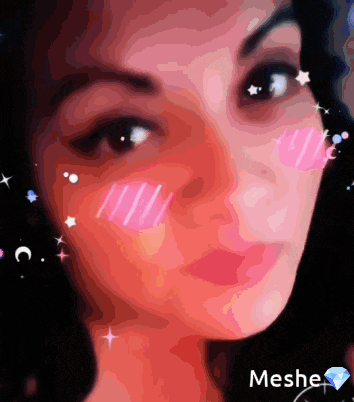 a close up of a woman 's face with meshe written below her