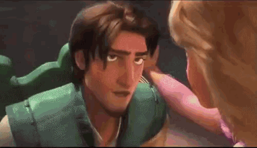 a man and a woman are standing next to each other in a room .